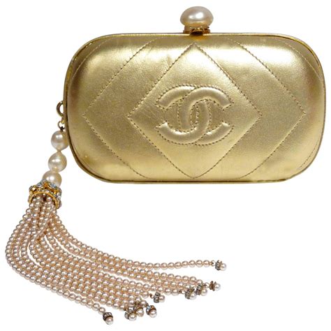 gold chanel clutch|chanel clutch with hand strap.